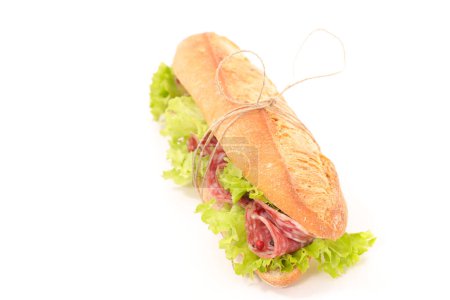 Photo for Sandwich- baguette with lettuce and salami isolated on white background - Royalty Free Image