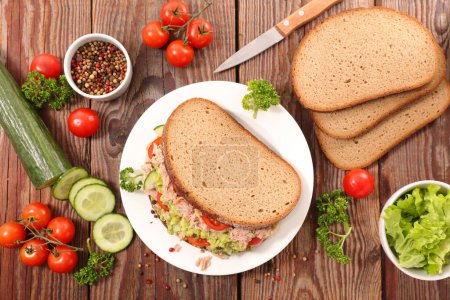 Photo for Bread sliced with tuna, avocado and vegetables- Sandwich - Royalty Free Image