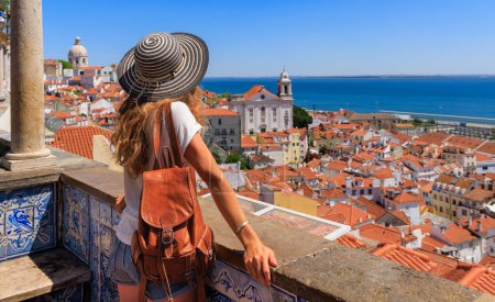 Photo for Woman tourist enjoying panoramic view of Lisbon city landscape- Portugal - Royalty Free Image
