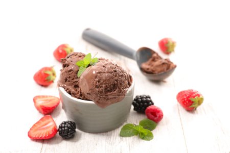 Photo for Chocolate ice cream scoop in bowl with fresh berries fruits - Royalty Free Image