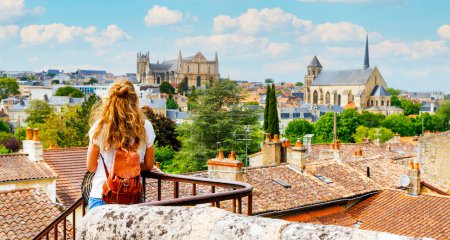 Photo for Poitiers city landscape viewpoint- Woman tourist looking at city skyline- vacation, travel destination, tourism in France- Poitou Charente, Vienne - Royalty Free Image
