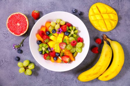 Photo for Delicious fruit salad with mango, berry and banana- health food - Royalty Free Image