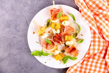 Photo for Prosciutto and ham with fresh basil - Royalty Free Image