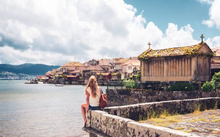 Woman tourist in Combarro- Spain, Galicia- travel destination