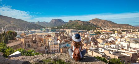 Photo for Panoramic of traveler woman and Roman amphitheater at Cartagena in Spain - Royalty Free Image