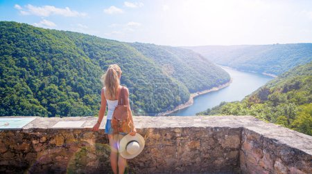 Photo for Woman standing looking at panoramic landscape view- Dordogne in France - Royalty Free Image