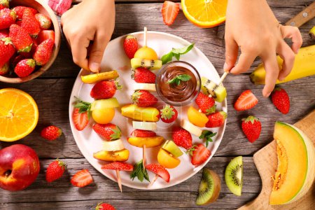 Photo for Fresh fruits and chocolate dipping sauce - Royalty Free Image