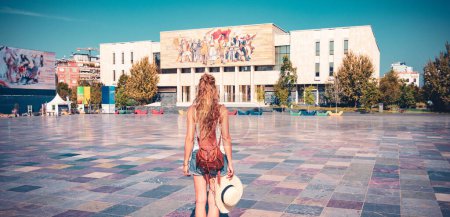 Photo for Traveler woman walking on square of Tirana city- Tour tourism in Albania - Royalty Free Image