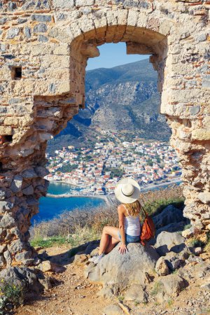 Woman tourist looking at panoramic view of Monemvasia town- Travel in Greece- Europa