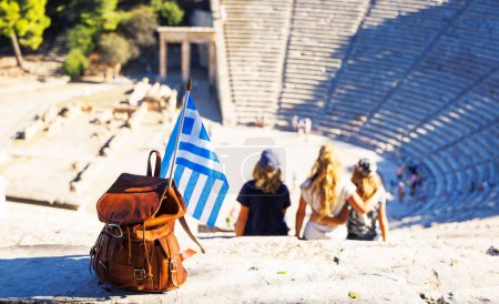Photo for Family visiting The ancient theatre of Epidaurus, Peloponnese in Greece- Travel destination, vacation, tour tourism - Royalty Free Image