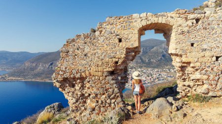 Photo for Traveler woman enjoying panoramic view of Monemvasia city and bay landscape in Greece, Peloponnese, - Royalty Free Image