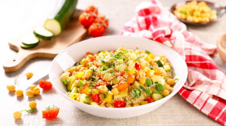 Photo for Tabbouleh salad with couscous and vegetables in bowl - Royalty Free Image