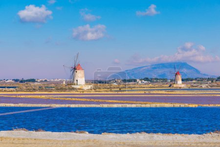 Photo for Windmill in the salt flats, Marsala, Sicily in Italy - Royalty Free Image