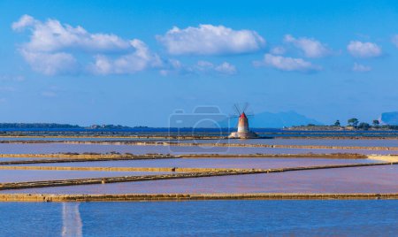 Photo for Sea salt with typical windmill- Sicilia in Italy - Royalty Free Image