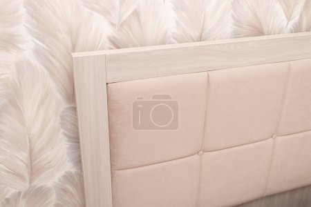 Téléchargez les photos : Beige soft modern bed with upholstered headboard. - en image libre de droit
