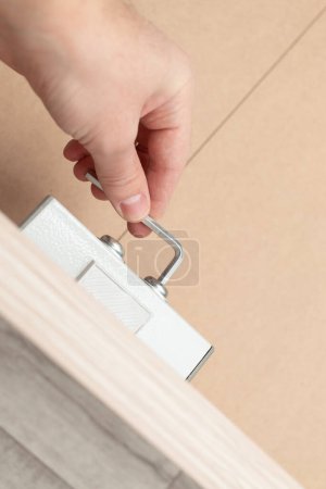 Téléchargez les photos : Assembling a new bed using a screwdriver - en image libre de droit
