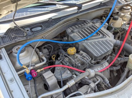 Photo for Refueling a car air conditioner with freon - Royalty Free Image