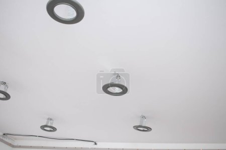 Photo for Installation of LED lamps on a stretch ceiling. - Royalty Free Image