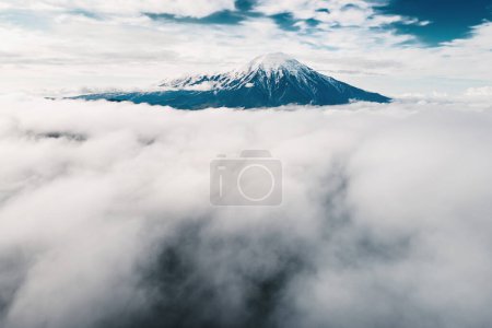 Photo for Tolbachik volcano with clouds at sunrise. Kamchatka peninsula, Russia. Aerial drone view. Beautiful summer landscape - Royalty Free Image