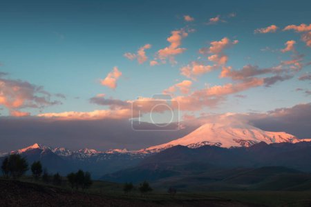 Photo for Elbrus mount with pink clouds at sunrise. View from Gil-Su valley in North Caucasus, Russia. Summer landscape. - Royalty Free Image