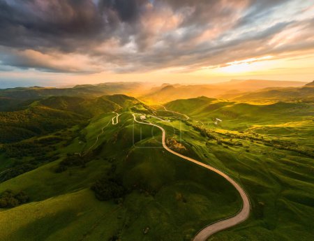 Panoramic view of the green mountains at sunset. Gumbashi Pass in North Caucasus, Russia. Summer landscape