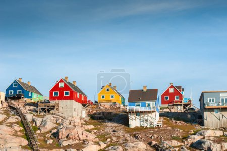 Colorful houses on the shore of Atlantic ocean in Ilulissat, western Greenland. Summer landscape
