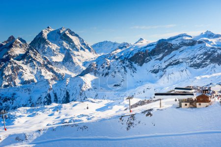 Photo for Ski resort in winter Alps mountains, France. View of ski slopes and ski lift. Meribel, France. Winter landscape - Royalty Free Image