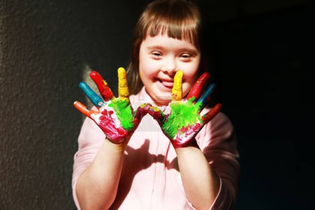Photo for Cute little girl with painted hands - Royalty Free Image