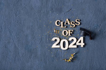 Photo for Class of 2024 concept. Number 2024 with graduated cap and confetti top view. - Royalty Free Image