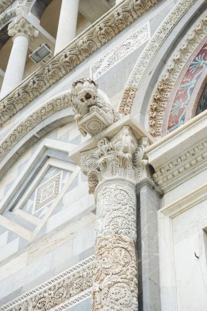 Photo for Beautiful carved marble column on the Duomo of Santa Maria Assunta in Pisa, Italy. Spectacular gothic architecture in one of Italy's most popular tourist attractions. - Royalty Free Image
