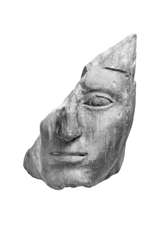 Foto de Cabeza de piedra rota antigua de un hombre griego. Primer plano aislado objeto de arte antiguo - Imagen libre de derechos
