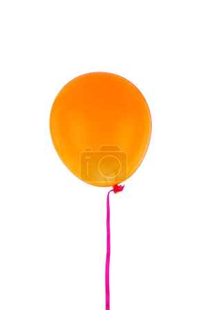 Photo for Orange balloon and ribbon flying isolated on white background - Royalty Free Image