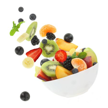 Photo for Fresh mixed fruits falling into a bowl isolated on white transparent background - Royalty Free Image