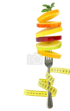 Photo for Healthy lifestyle, Fresh fruits slices and a measure tape isolated on white transparent background - Royalty Free Image