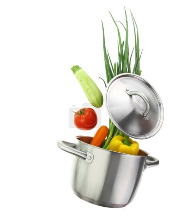 Photo for Fresh vegetables falling into a cooking pot isolated on white transparent background - Royalty Free Image