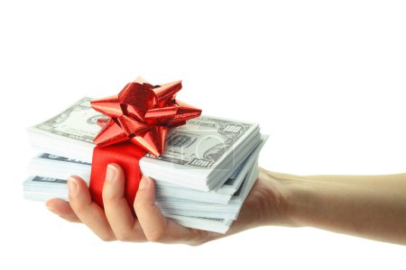 Photo for Money gift in a female hand, isolated on white transparent background, US dollars stack and red bow, festive present. - Royalty Free Image