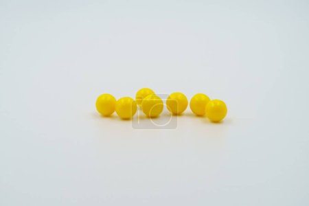 Photo for Yellow vitamin capsules, dietary supplements. Medicinal pills, pharmaceutical healthcare products, drugs for medical treatment, therapeutic medication, pharmacological, health aid - Royalty Free Image
