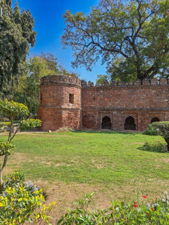 Photo for Ancient fortress wall near mausoleum, Sikandar Lodi Tomb, Delhi. Intact battlements, arched recesses, bastion. Indo-Islamic architecture. Historical monument, citadel, ramparts. Mughal Empire - Royalty Free Image