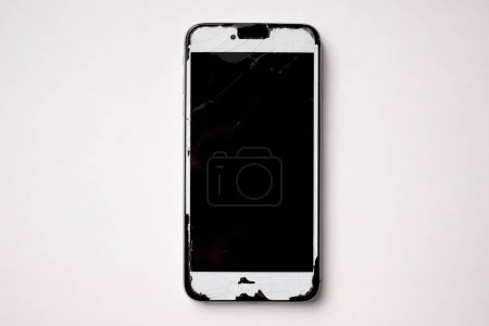 Photo for Broken phone isolated over white background empty space for promotional text, advertisement area. - Royalty Free Image