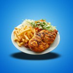 Floating of Piri Piri Chicken on white plate on blue gradient background