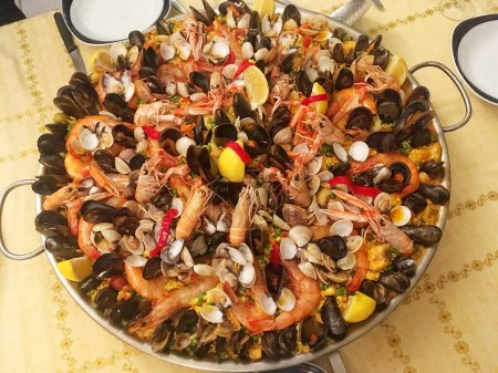 Photo for Top view from above on a seafood paella on table - Royalty Free Image