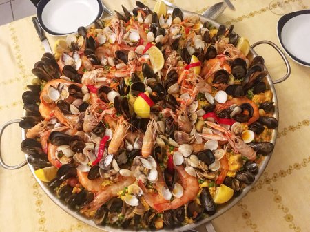 Photo for Top view from above on a seafood paella on table - Royalty Free Image
