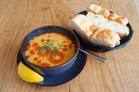 Lentil or tripe soup on wooden textured table