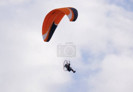 Photo for Italy, Sicily, Marina di Ragusa (Ragusa Province); 16 September 2023, man flying on a powered paraglider - EDITORIAL - Royalty Free Image