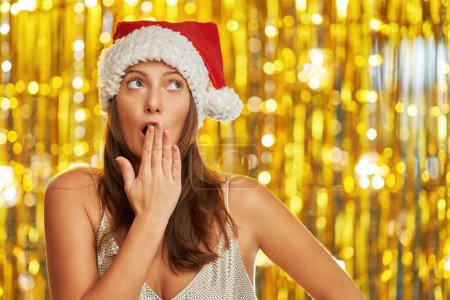 Photo for Woman over gold background making funny faces. High quality photo - Royalty Free Image