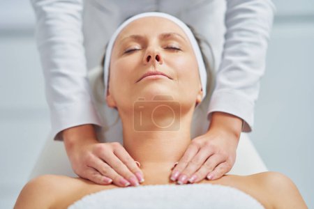 Photo for Young nice woman having face massage in spa. High quality photo - Royalty Free Image