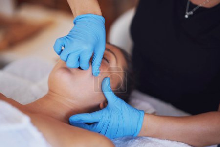 Photo for Woman having mouth massage in blue gloves. High quality photo - Royalty Free Image