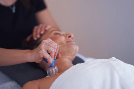 Photo for Woman having a face cupping massage in salon. High quality photo - Royalty Free Image