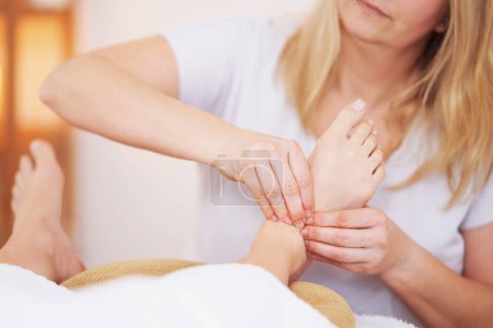 Photo for Woman having foot reflexology massage in salon. High quality photo - Royalty Free Image