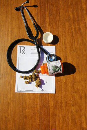 Photo for Medical Marijuana. Close Up Cannabis. Doctors Prescription For Weed. Medicinal Pot With Stethoscope. A prescription for medical marijuana. Medical cannabis on table close up. - Royalty Free Image